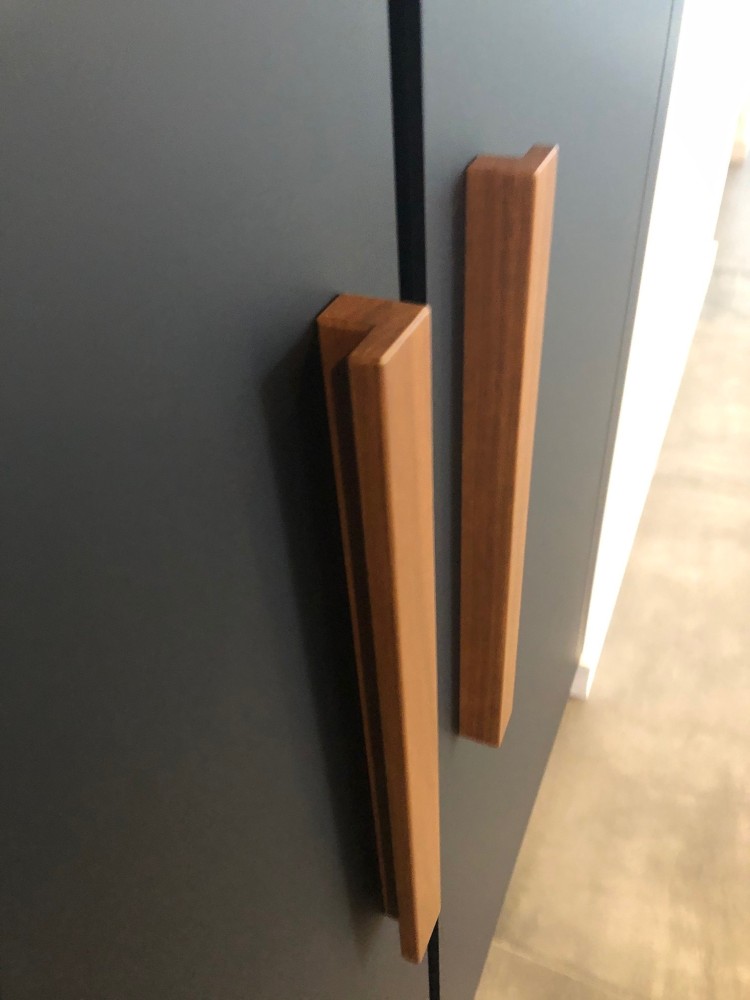 Spotted Gum handles on black cupboard doors